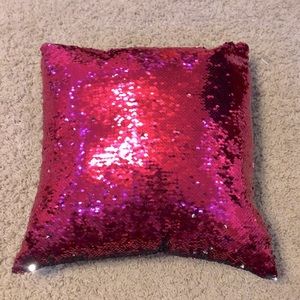 This sequence pink and silver pillow